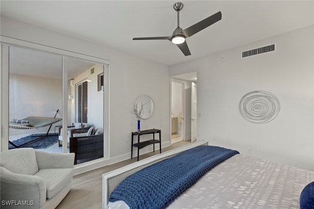 bedroom with ceiling fan and light hardwood / wood-style flooring