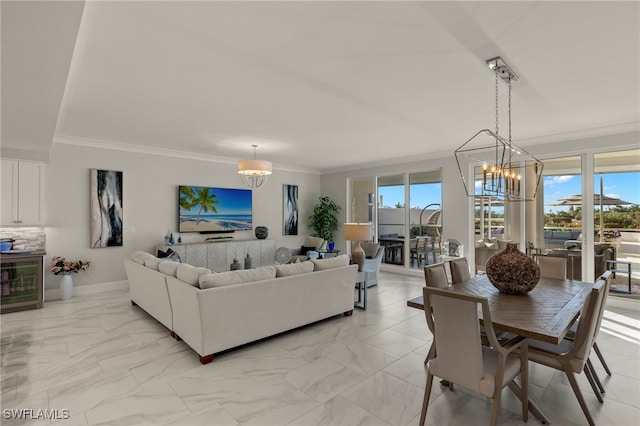 living room with an inviting chandelier, wine cooler, and ornamental molding