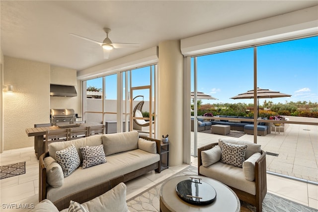 tiled living room with ceiling fan