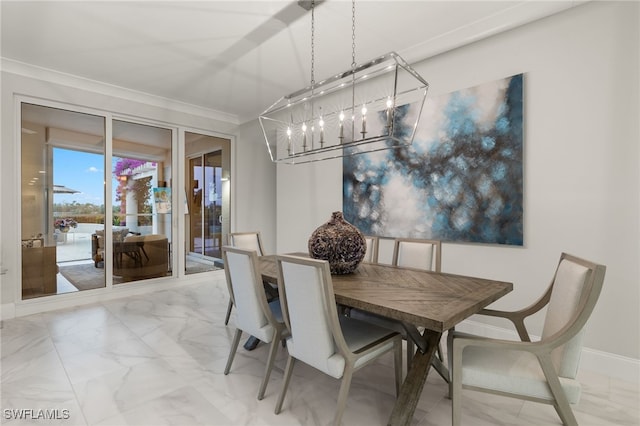 dining area featuring crown molding