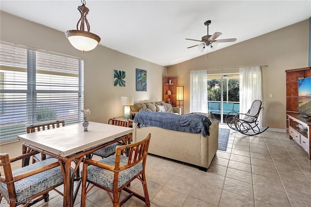 bedroom featuring ceiling fan, vaulted ceiling, and light tile patterned floors