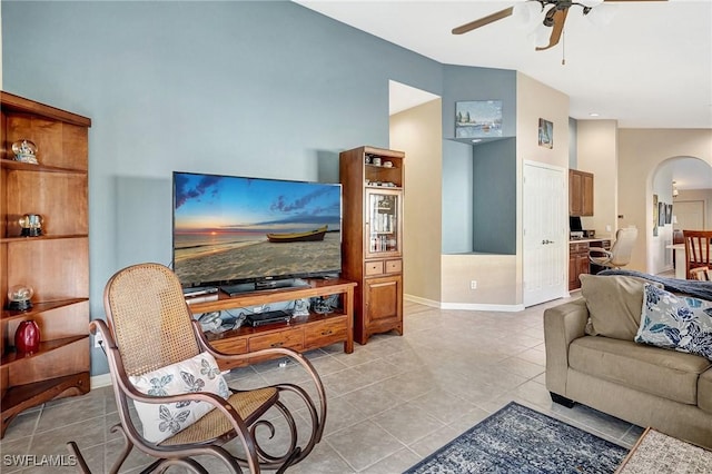 living room featuring light tile patterned flooring and ceiling fan