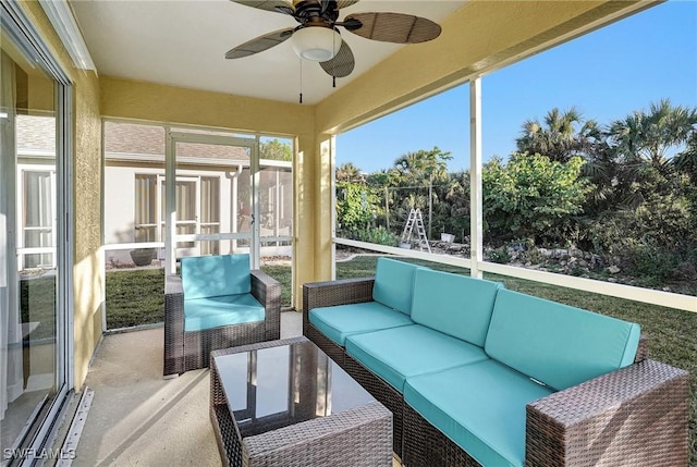 sunroom / solarium featuring ceiling fan