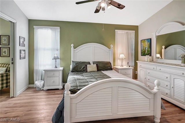 bedroom featuring hardwood / wood-style flooring and ceiling fan