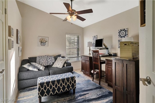 living room with lofted ceiling, ceiling fan, and light hardwood / wood-style flooring