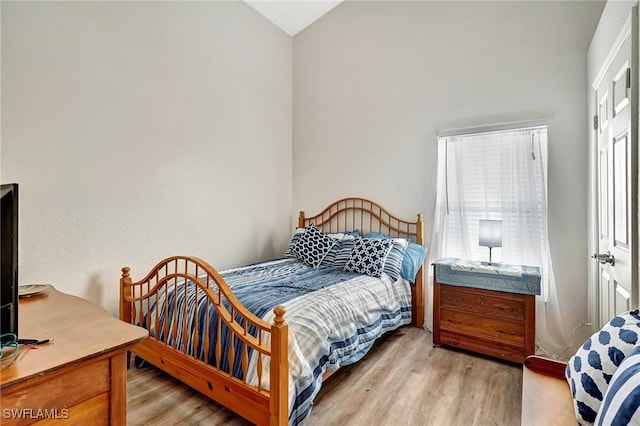 bedroom with light hardwood / wood-style flooring