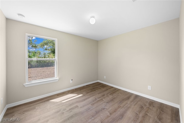 spare room with light wood-type flooring