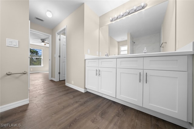 bathroom featuring vanity, hardwood / wood-style flooring, and ceiling fan