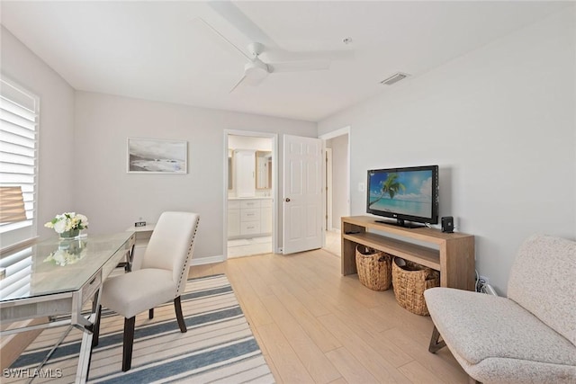 office space with ceiling fan and light hardwood / wood-style flooring