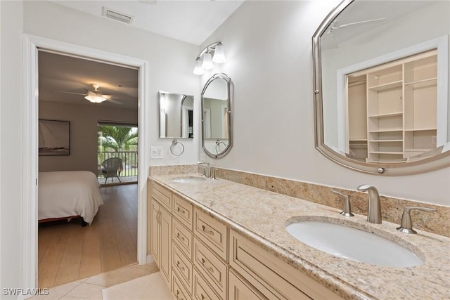 bathroom featuring tile patterned floors, ceiling fan, and vanity