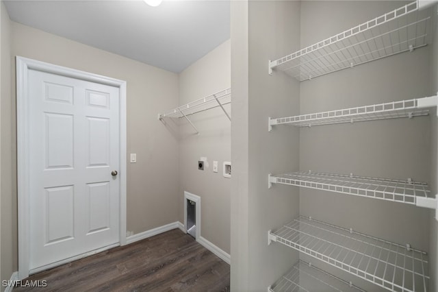 laundry room with dark wood-type flooring, washer hookup, and hookup for an electric dryer