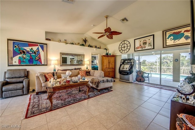 tiled living room with ceiling fan and lofted ceiling