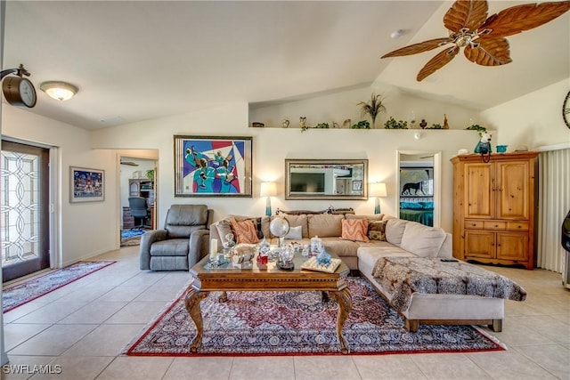 tiled living room featuring ceiling fan and vaulted ceiling