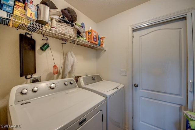 laundry room with washer and dryer