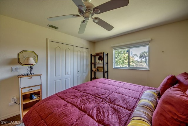 bedroom featuring ceiling fan and a closet