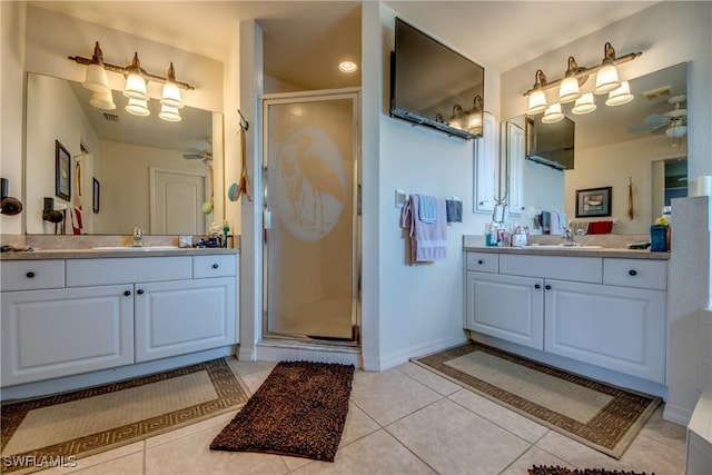 bathroom with tile patterned floors, vanity, and an enclosed shower