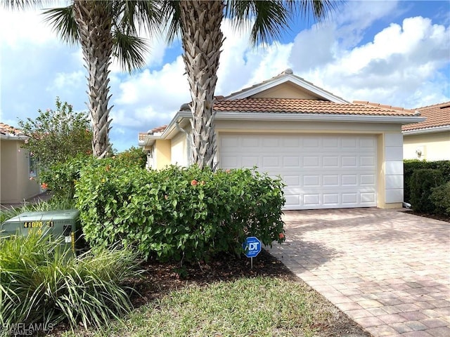 view of side of property featuring a garage