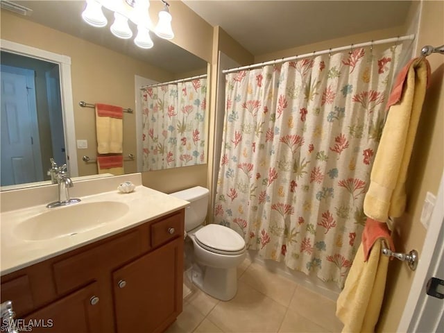 bathroom featuring toilet, vanity, and tile patterned floors