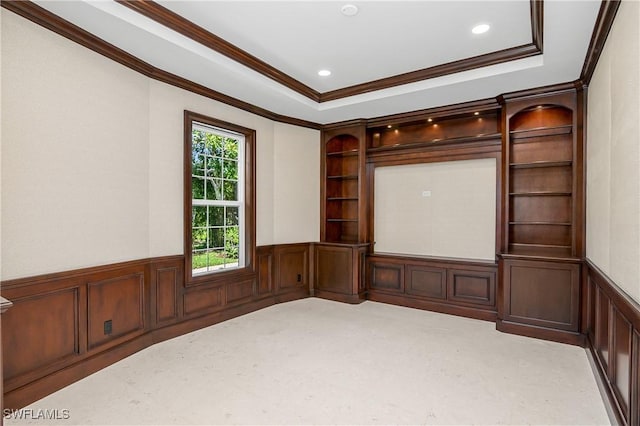 interior space with crown molding, light carpet, and a tray ceiling