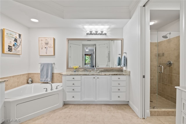 bathroom with tile patterned floors, vanity, separate shower and tub, and crown molding