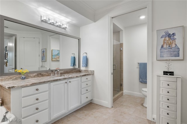 bathroom featuring toilet, a shower with door, crown molding, tile patterned floors, and vanity