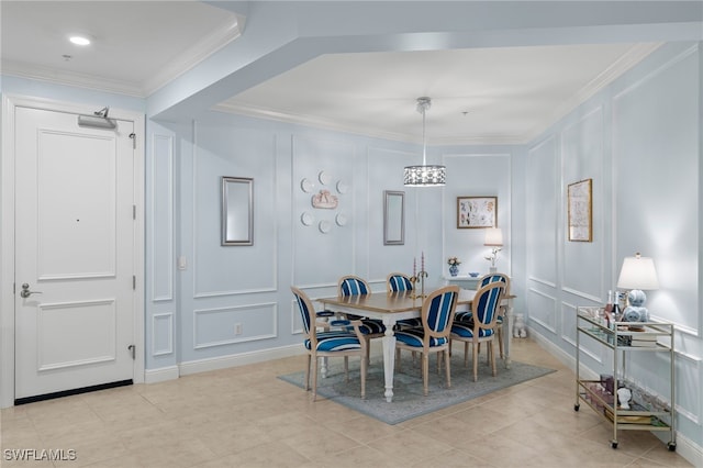 dining room with light tile patterned floors and crown molding