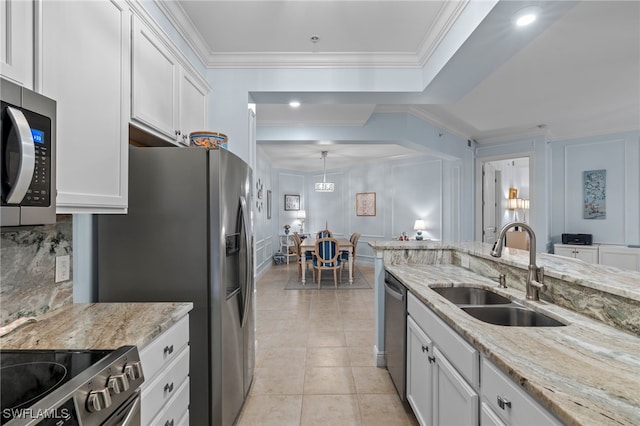 kitchen featuring white cabinets, light stone countertops, sink, and appliances with stainless steel finishes