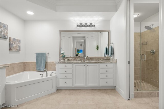 bathroom with tile patterned floors, plus walk in shower, and vanity