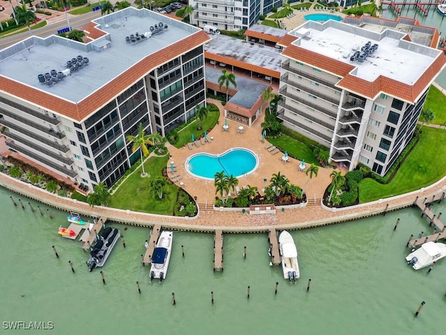 birds eye view of property with a water view