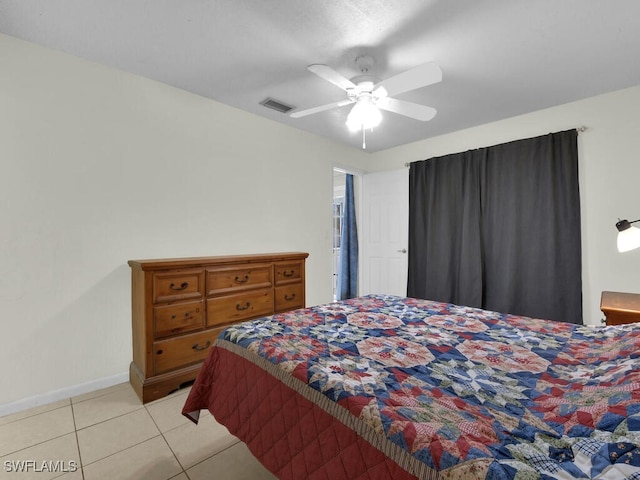 bedroom featuring ceiling fan and light tile patterned floors