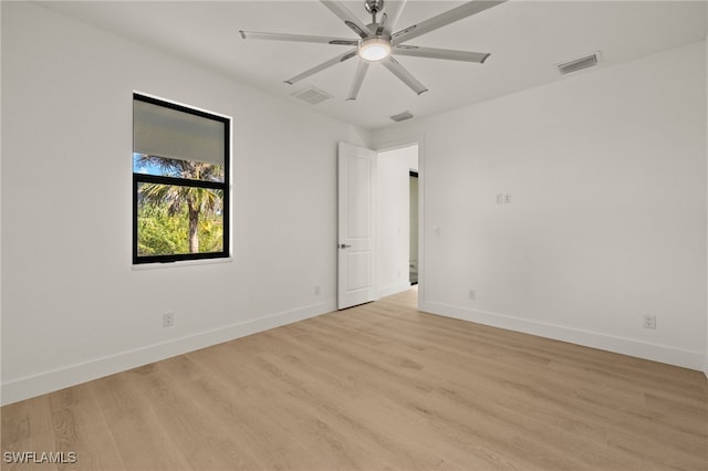 spare room featuring ceiling fan and light hardwood / wood-style floors