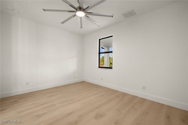 empty room featuring ceiling fan and light hardwood / wood-style flooring