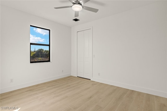 spare room with ceiling fan and light hardwood / wood-style floors