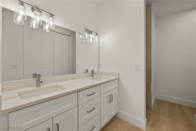 bathroom with vanity and hardwood / wood-style floors