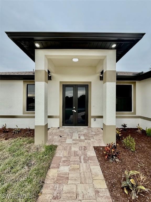 entrance to property featuring french doors