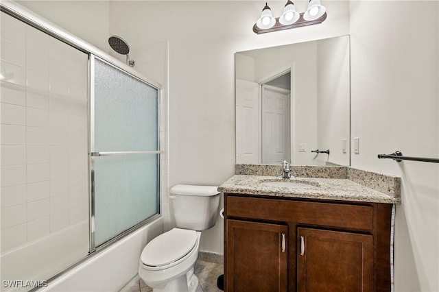 full bathroom with vanity, toilet, and shower / bath combination with glass door