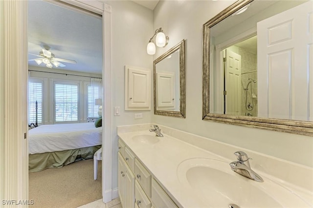 bathroom with vanity, walk in shower, and ceiling fan