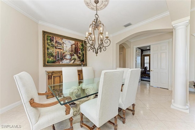 dining room with light tile patterned floors, ornate columns, a notable chandelier, and crown molding