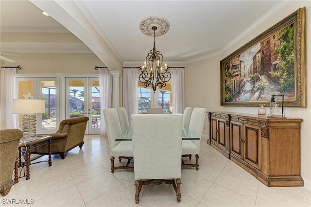 tiled dining room featuring ceiling fan with notable chandelier, crown molding, and french doors