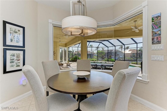 tiled dining area featuring ceiling fan