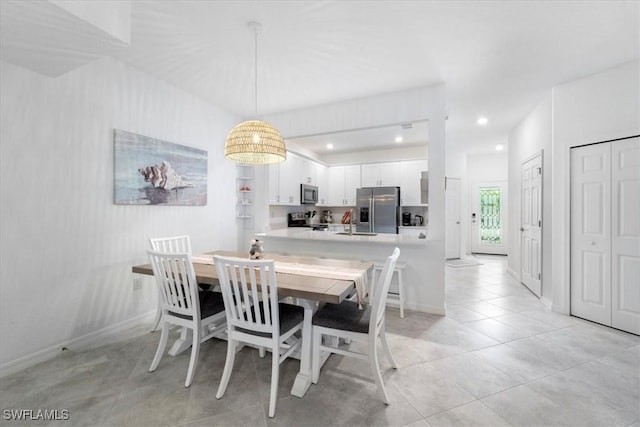 dining room featuring light tile patterned flooring