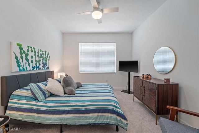 bedroom featuring light colored carpet and ceiling fan