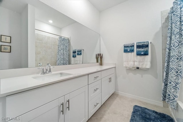 bathroom with tile patterned flooring, a shower with shower curtain, and vanity