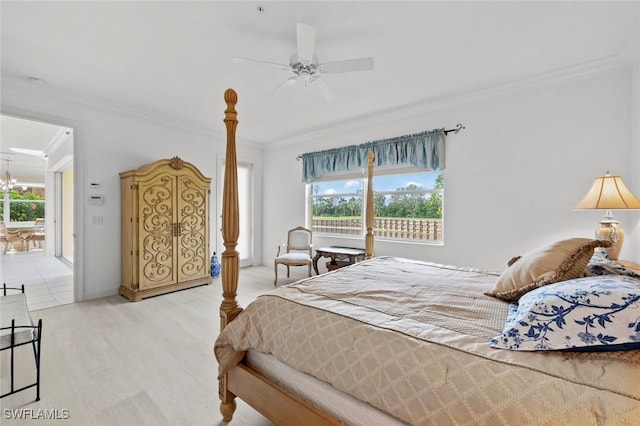 bedroom with ceiling fan with notable chandelier, ornamental molding, and wood finished floors