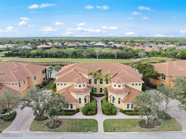 birds eye view of property with a residential view