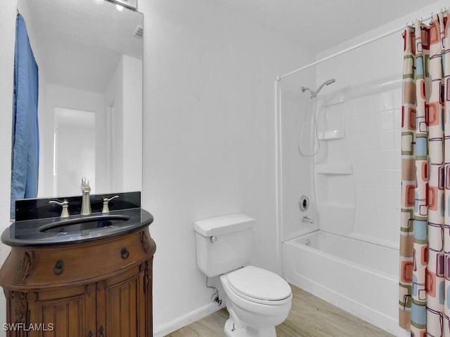 full bathroom featuring shower / bath combination with curtain, vanity, toilet, and hardwood / wood-style floors