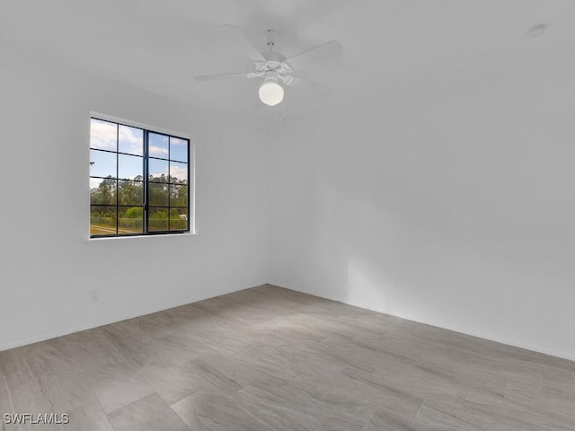 empty room featuring ceiling fan