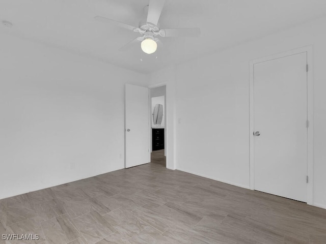 unfurnished room featuring ceiling fan