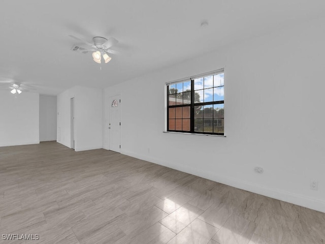 spare room with ceiling fan