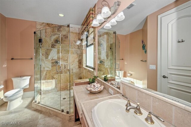 bathroom with toilet, an enclosed shower, and vanity